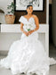 Robe de mariée  princesse, avec corset, décolleté cœur, volants en organza, traîne cathédrale